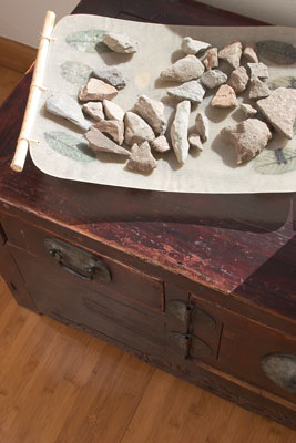 Stones collected from Stephanie’s travels nestle in an earthen tray.